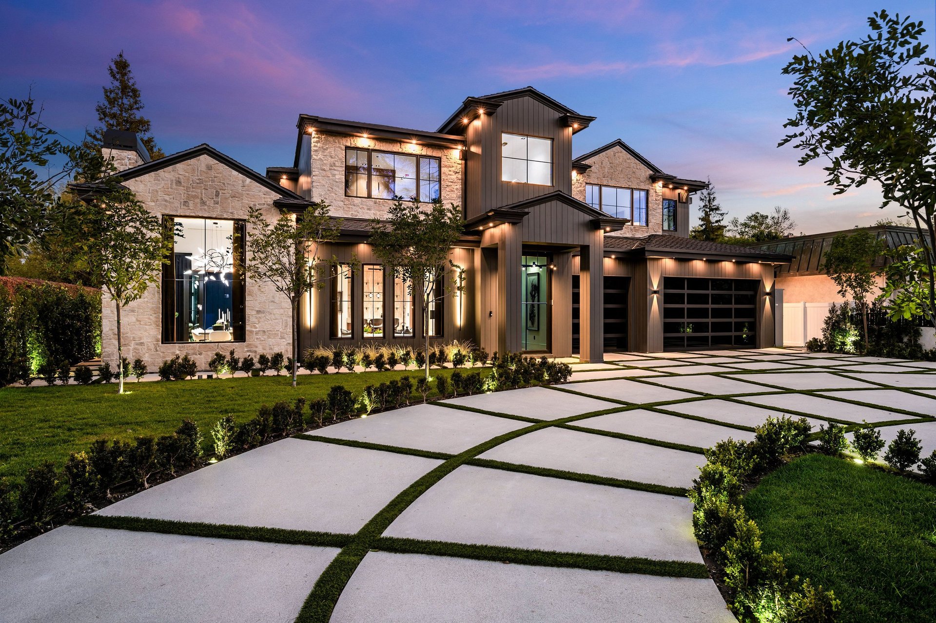 Modern luxury home with elegant exterior lighting at dusk